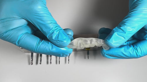 AccuraGUIDE dental implant surgical guide during guided implant surgery with precise drill positioning and post operative x ray results